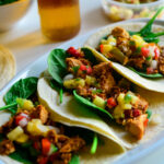 Salmon taco topped with Pineapple salsa
