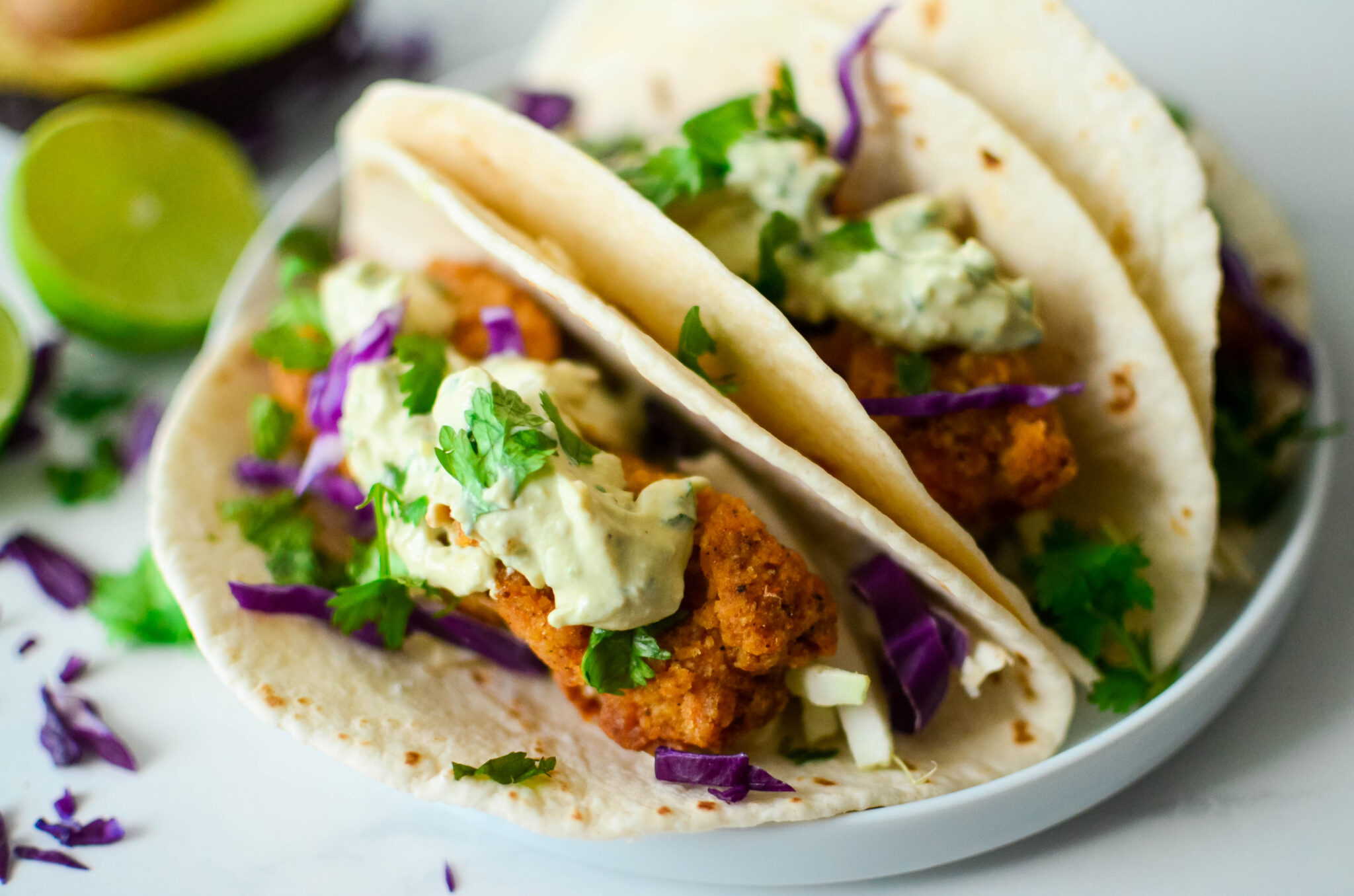 Crispy Oven-Fried Fish Tacos with Avocado Lime Crema – Forks and Straws